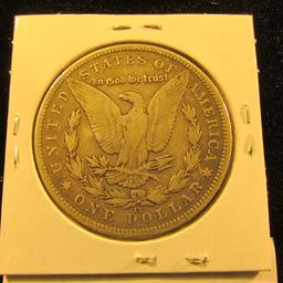 1667 . 1890 CC Morgan Silver Dollar, large scratch on face.