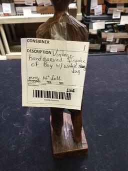 vintage hand, carved figure of boy with water jug