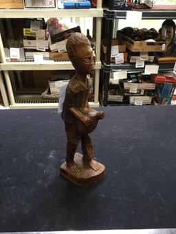vintage hand, carved figure of boy with water jug