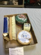 box of vintage, saddle, soap, brushes, and other miscellaneous