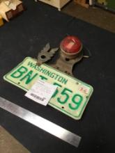 Vintage car, tail light with license plate combo with safety badge