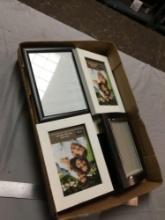 box of miscellaneous new frames