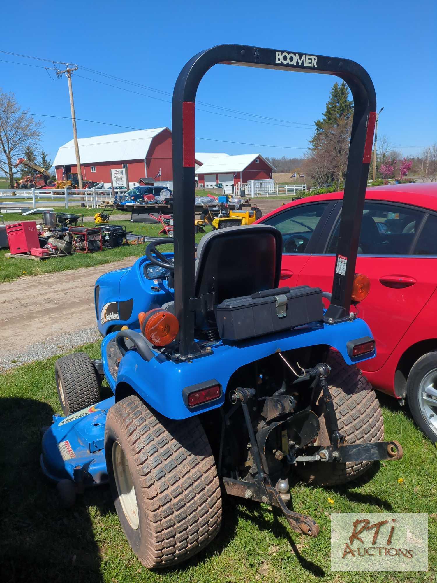 New Holland TZ25DA compact tractor, 60in belly mower, lift arms, PTO, HST, high/low range, 4WD, 210