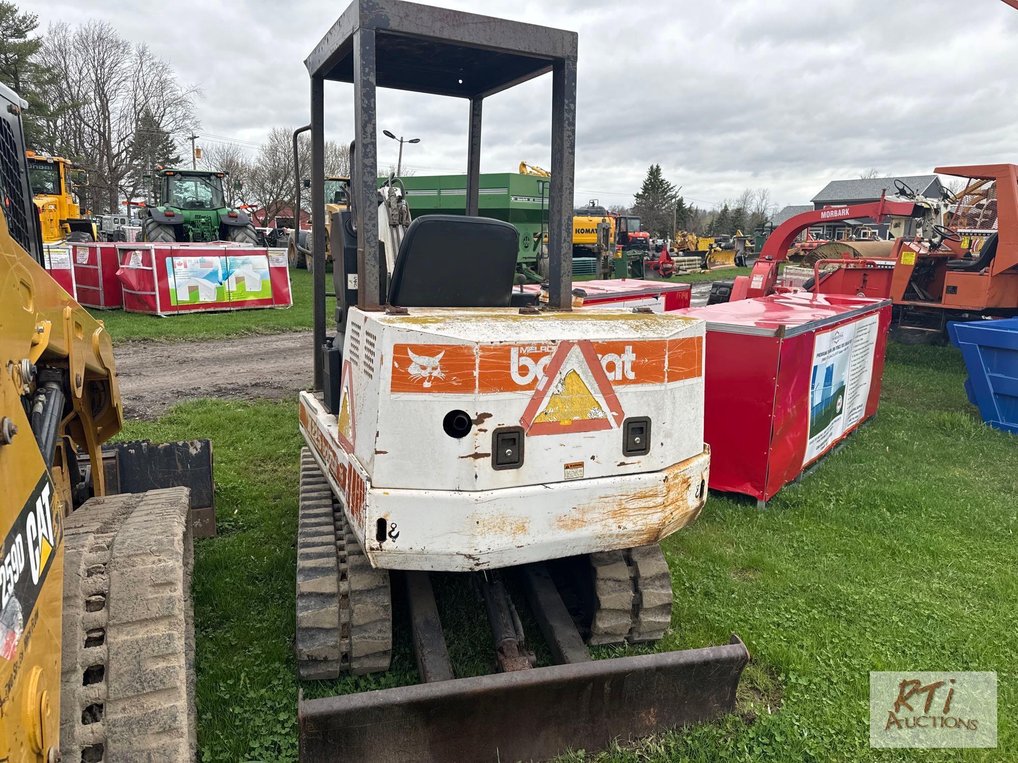 Bobcat X225 excavator, front blade, 24in bucket, diesel engine