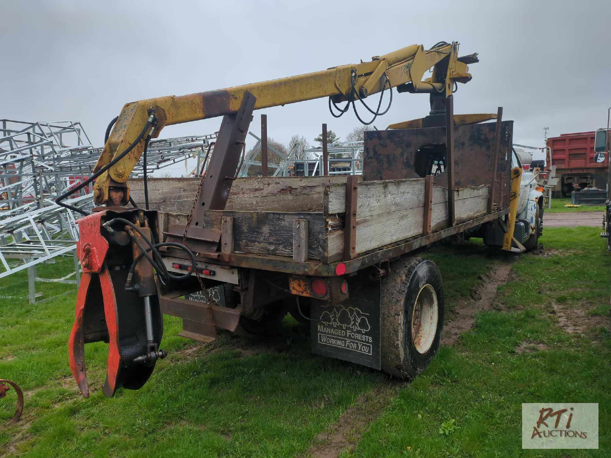 Chevy 7000 single axle flatbed grapple truck, with John Deere log grapple, outriggers, 5-speed