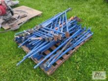 Pallet of scaffolding extensions with shingle shovel