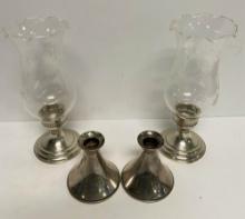 TWO PAIRS OF STERLING SILVER CANDLESTICKS
