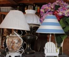 THREE TABLE LAMPS AND FLOWERS