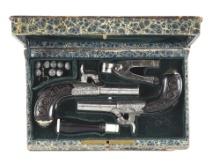 (A) PAIR OF BELGIAN PERCUSSION MUFF PISTOLS IN BOOK-FORM CASE.