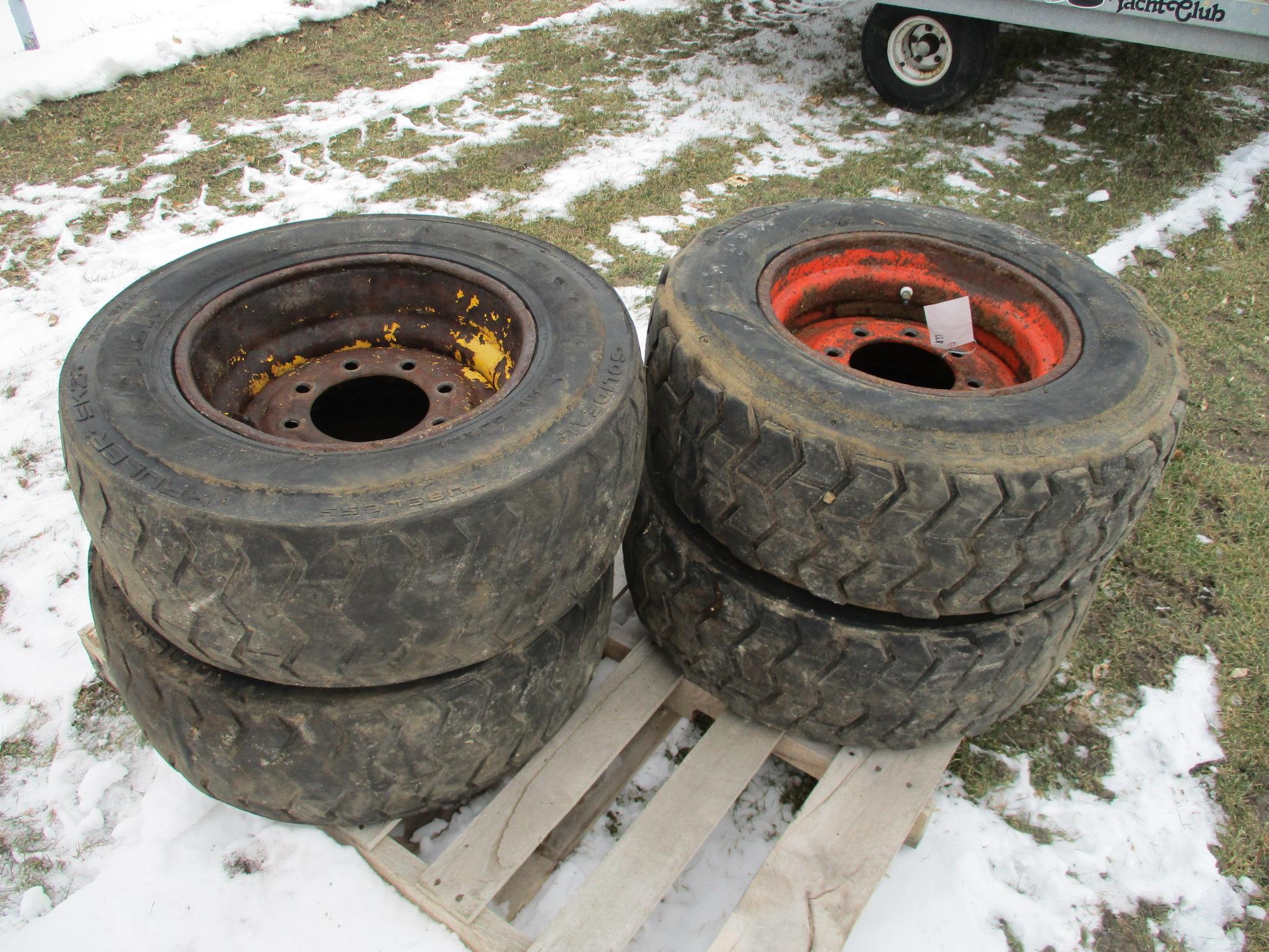 Four 10 - 16.5 skid loader tires & rims