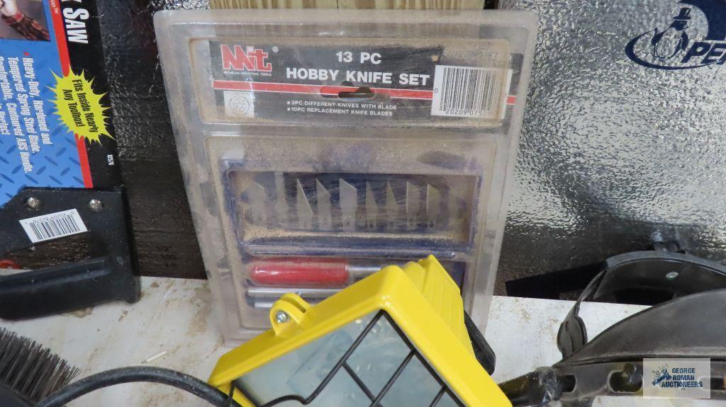 halogen work light, hobby knife set, 15 inch tool box saw, etc