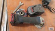 Bosch angle grinder with one battery, charger, cutting and flax wheel and key