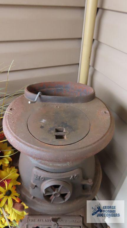 The Atlanta Stove Works number 40 pot belly stove with cast iron kettle