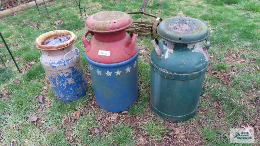 Three vintage milk cans