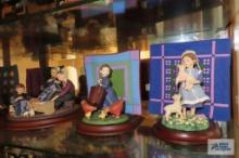 Five Amish Heritage figurines with quilt patch background
