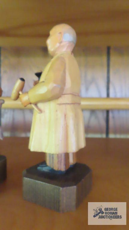Hunter wood carved figurine and Psychiatrist figurine