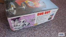 Revell Bug Out model box, model pieces, and other toy pieces in box