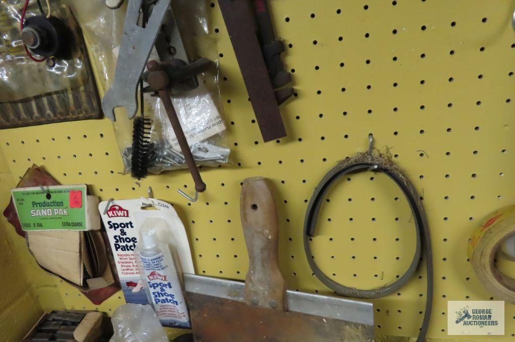 tools, hardware and etc on pegboard