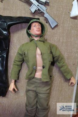 Two vintage GI Joe action figures from 1964 with accessories. one figure is missing a hand.