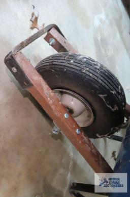 Scott's seeder and pneumatic tire wheelbarrow, wheelbarrow is bent