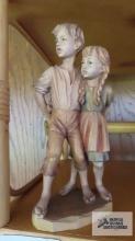 boy and girl wood carved figurine