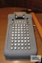 Vintage calculator made by Tower and drafting table accessories