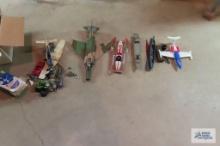 lot of plastic toys including airplanes and boats