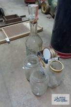 lot of canning jars and lids and Jack Daniels gold medal decanter