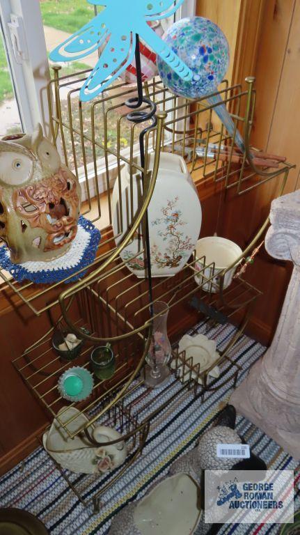 metal plant stand with assorted decorative items