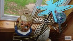 metal plant stand with assorted decorative items
