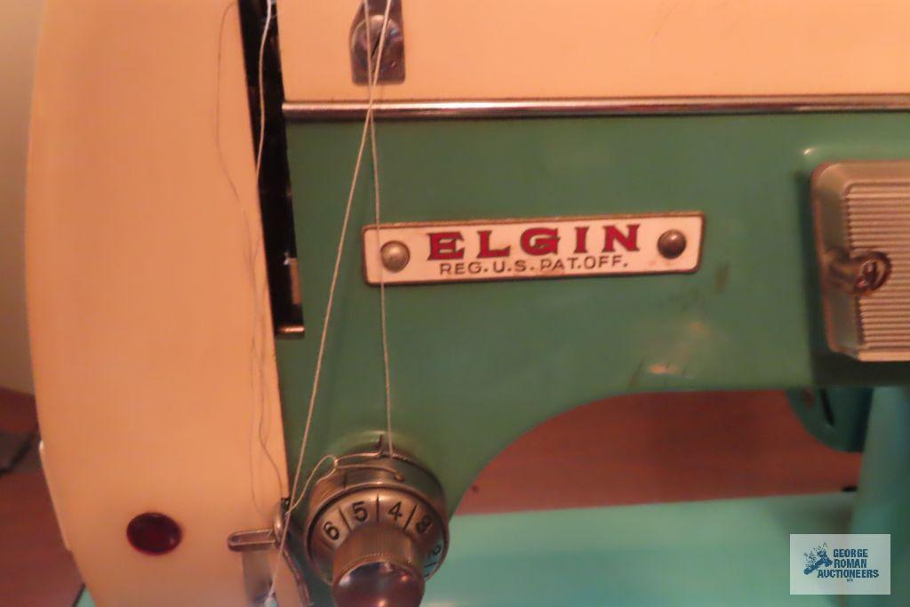 Elgin sewing machine in cabinet