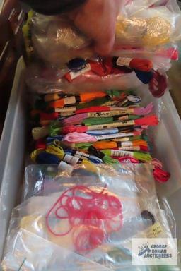 Plastic sewing box with sewing materials, embroidery thread