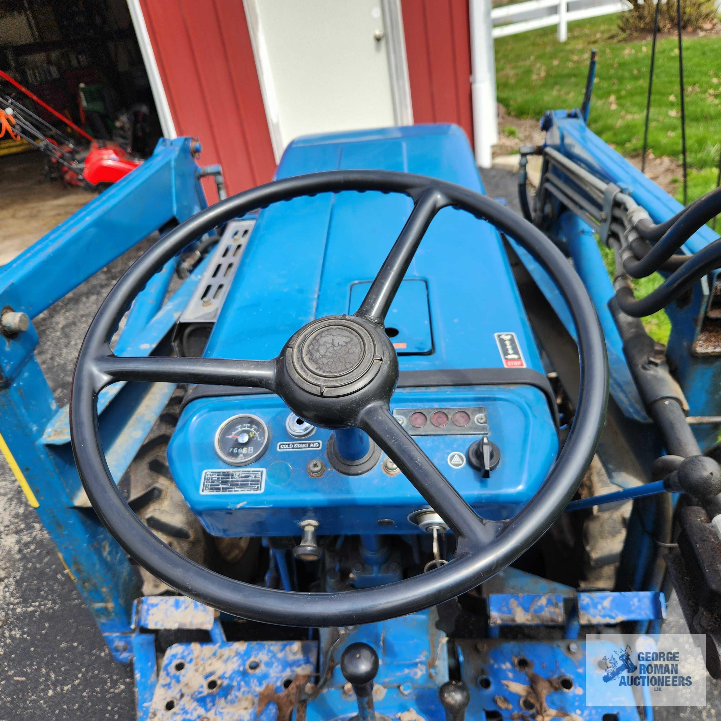Ford 1200 diesel tractor with Ford 768 loader attachment. Showing 758 hours. Welded hook on bucket.