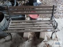 Wooden park bench with cast iron legs