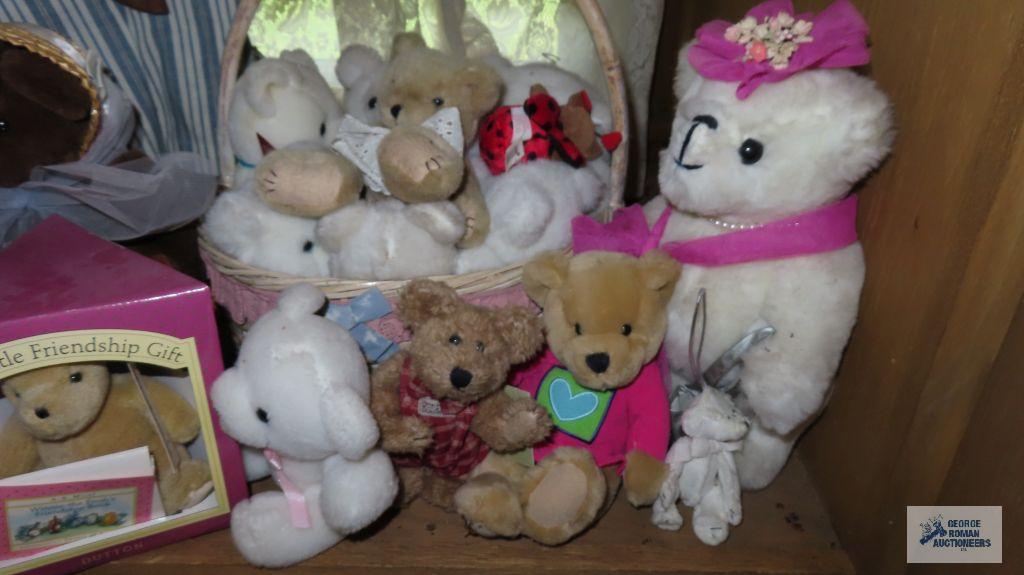 Large assortment of teddy bears and rabbits on a bench