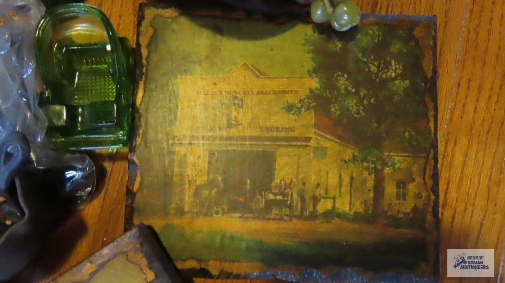 Vintage pictures on wooden plaques, cast iron pieces, insulators, and small decorative log basket