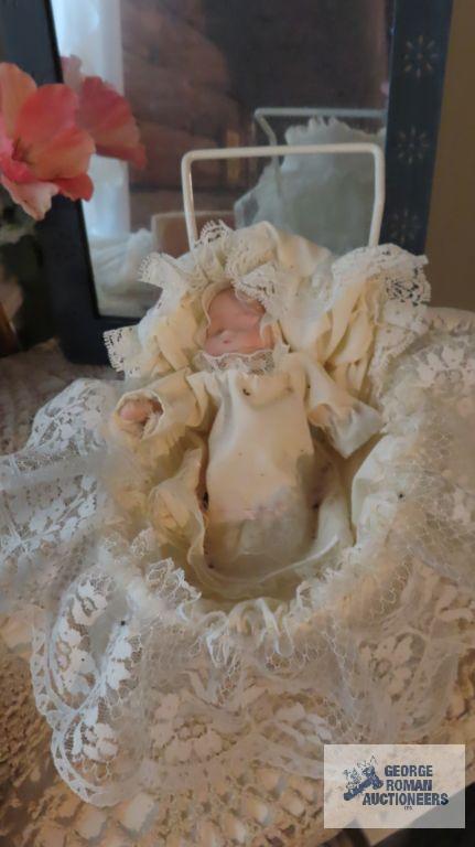 Miscellaneous items including Teddy bears, floral arrangement, candle holder, miniature baby with