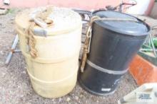 Plastic 50 gallon barrels with water line and PVC pipe