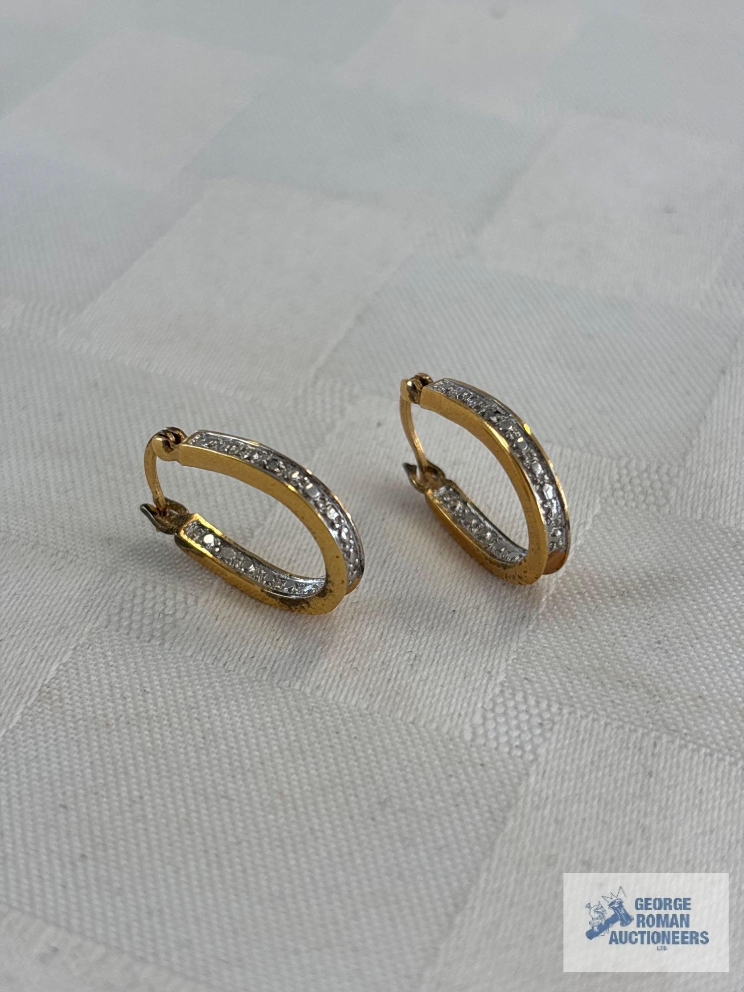 Pair of gold colored hoop earrings, marked 925