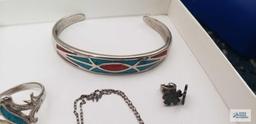 Silver with turquoise colored inlaid stone jewelry