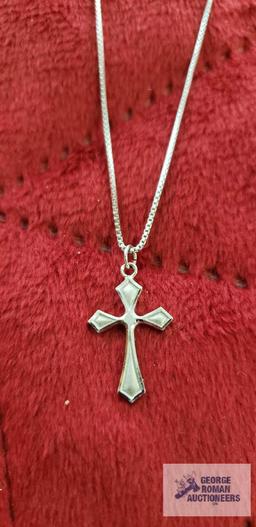 Silver colored cross pendant, marked Sterling, on silver colored box chain, marked 925, approximate