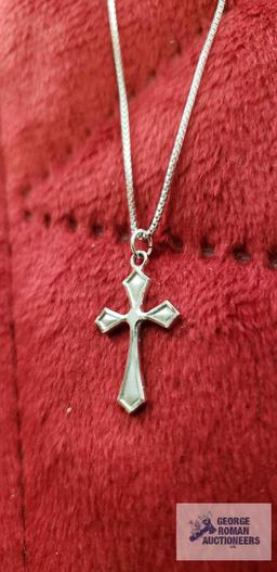 Silver colored cross pendant, marked Sterling, on silver colored box chain, marked 925, approximate
