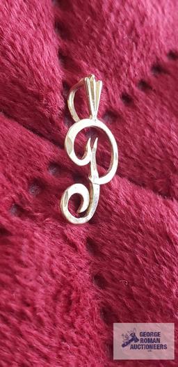 Gold colored "P" pendant, marked 14K, approximate total weight is .58 G