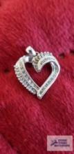 Silver colored and clear gemstone heart-shaped pendant, marked 10K, approximate total weight is 1.78
