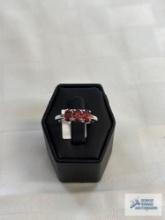 Silver color ring with three red gemstones, marked 925 Thailand, approximate total weight is 2.45 G
