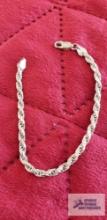Silver colored rope bracelet, marked 925 Italy, approximate total weight is 7.73 G