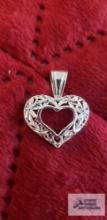 Silver colored heart pendant, marked 925, approximate total weight is 1.91 G