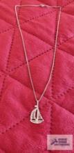 Silver colored sailboat pendant, marked 925, on silver colored box chain, marked 925 Italy,