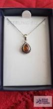 Amber colored stone teardrop shaped pendant on silver colored chain, chain marked 925 Italy