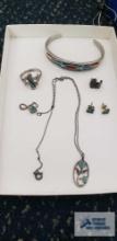 Silver with turquoise colored inlaid stone jewelry